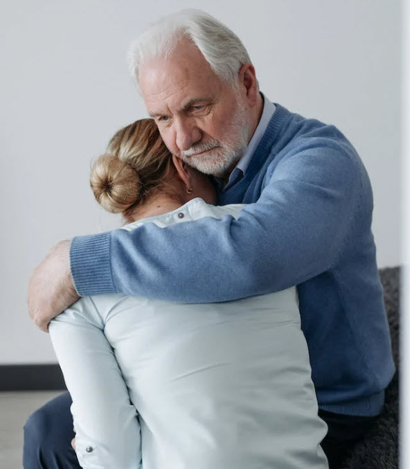Man and woman suffering from grief and loss of a loved one
