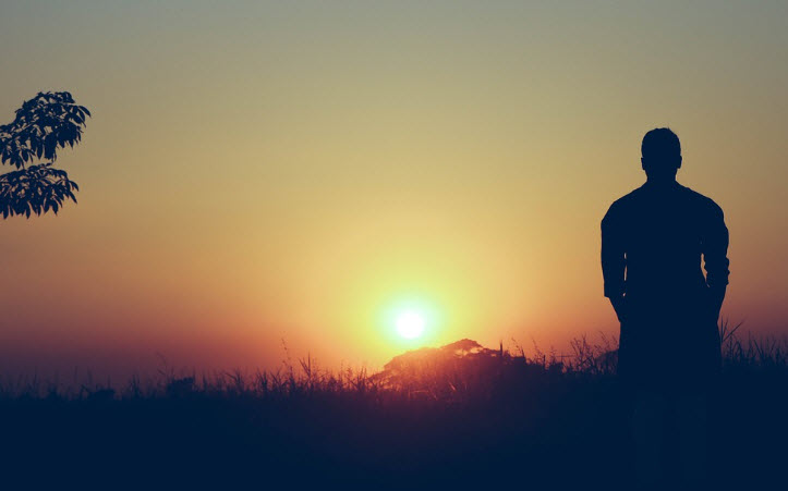 Silhouette of man experiencing trauma symptoms