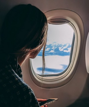 Fear of flying phobia depicted by women in airplane