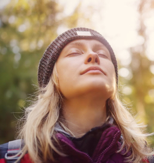 Woman looking to sky after being helped by self esteem therapy